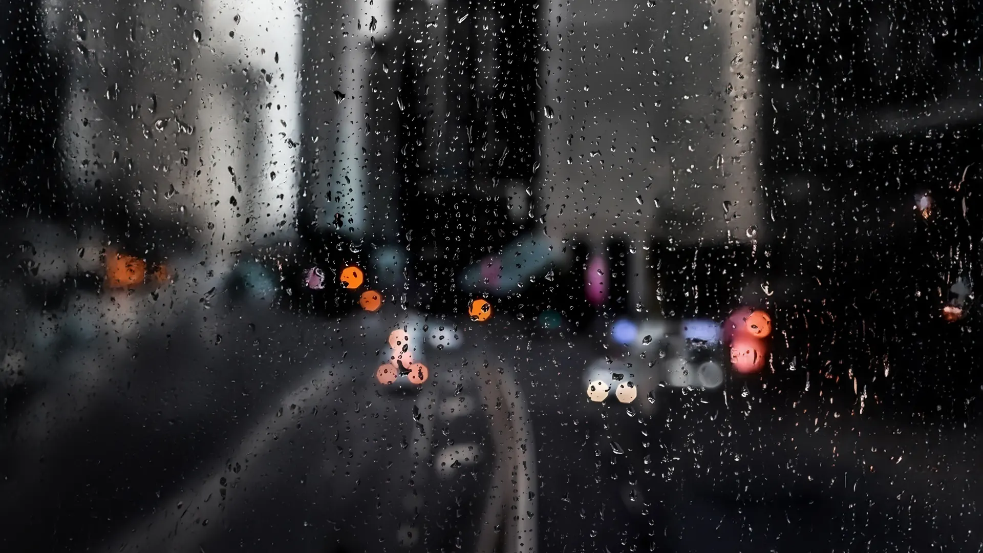 Rainy City Window at Night Wallpaper