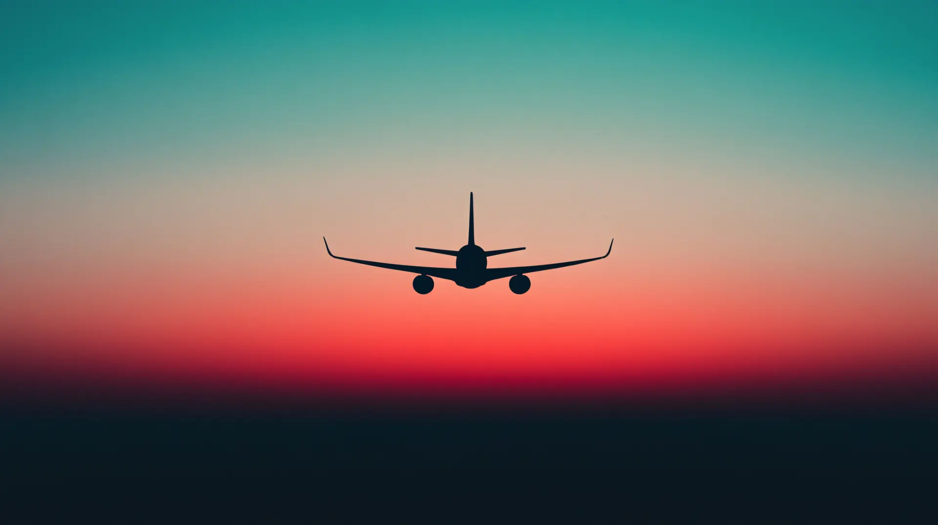 Airplane Silhouette Flying into a Colorful Sunset Wallpaper