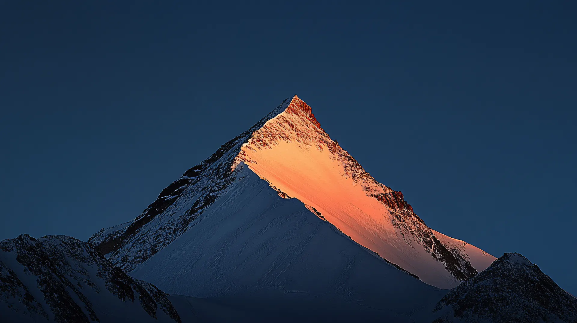 Sunlit Snowy Mountain Peak Wallpaper