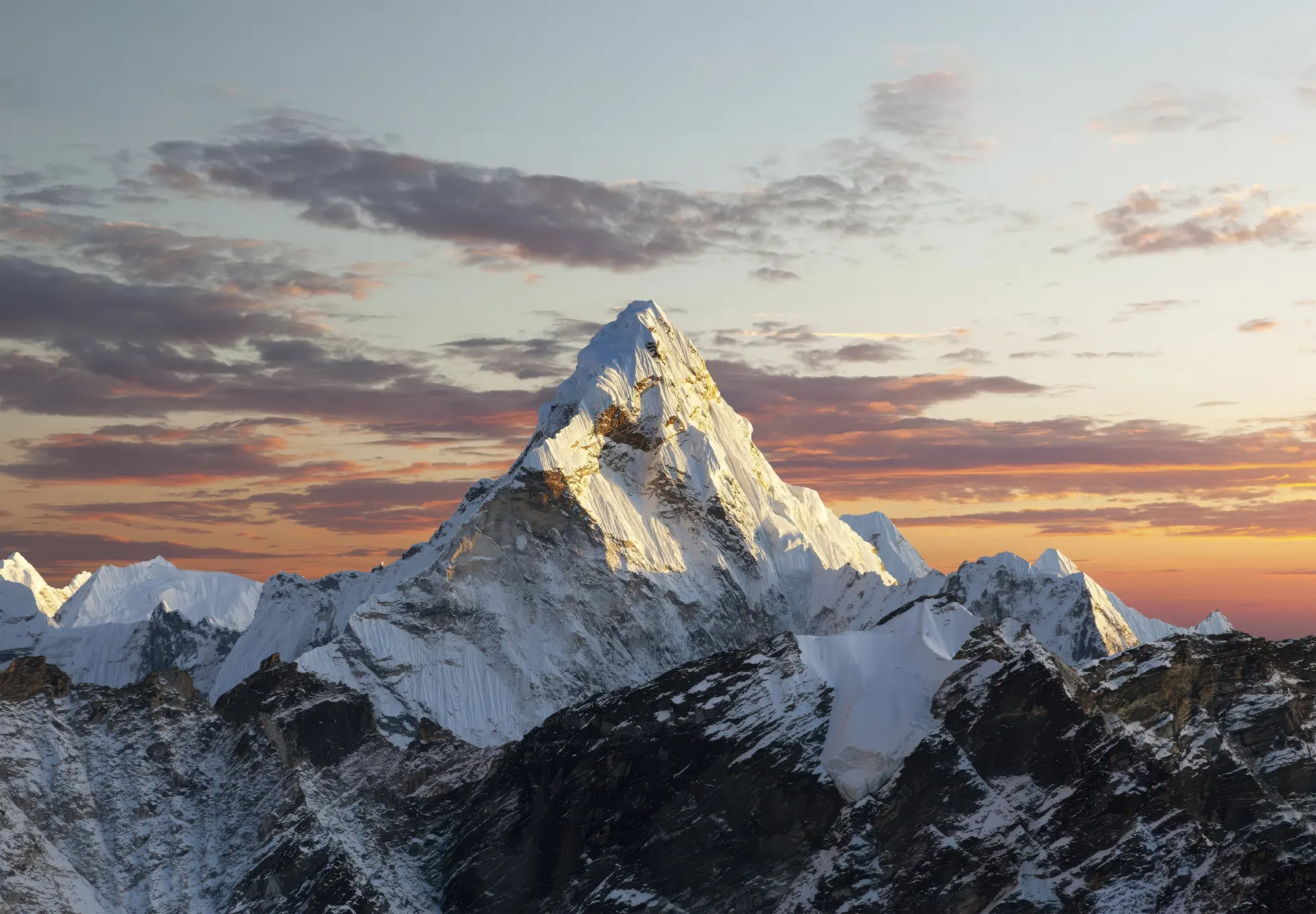 Snow-Covered Mountain at Golden Sunrise Wallpaper